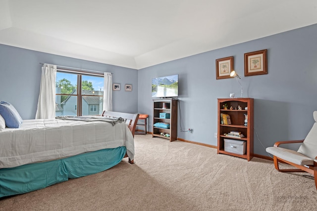 bedroom with baseboards, carpet, and multiple windows