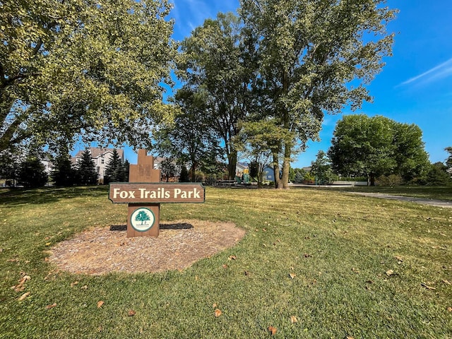 view of property's community with a yard