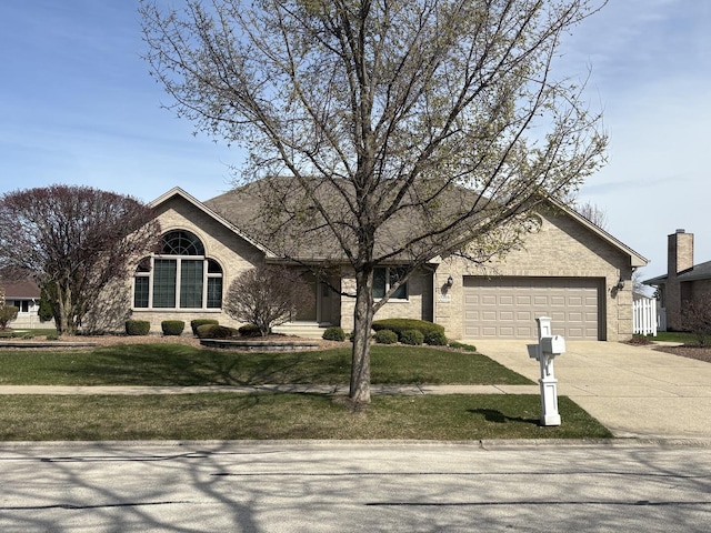 17205 Briar Dr, Tinley Park, IL 60487 - view of front facade featuring concrete driveway, an attached garage, and a front lawn