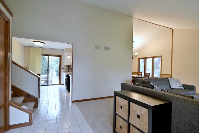 1167 Timberlane Ct, Naperville, IL 60540 - living area with light tile patterned flooring, high vaulted ceiling, visible vents, and stairway