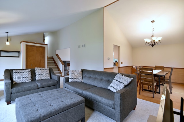 1167 Timberlane Ct, Naperville, IL 60540 - living room featuring visible vents, stairs, high vaulted ceiling, light wood-style flooring, and a notable chandelier