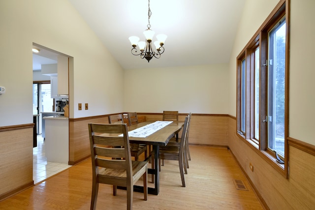 1167 Timberlane Ct, Naperville, IL 60540 - dining room with visible vents, a notable chandelier, a wainscoted wall, lofted ceiling, and light wood-style flooring