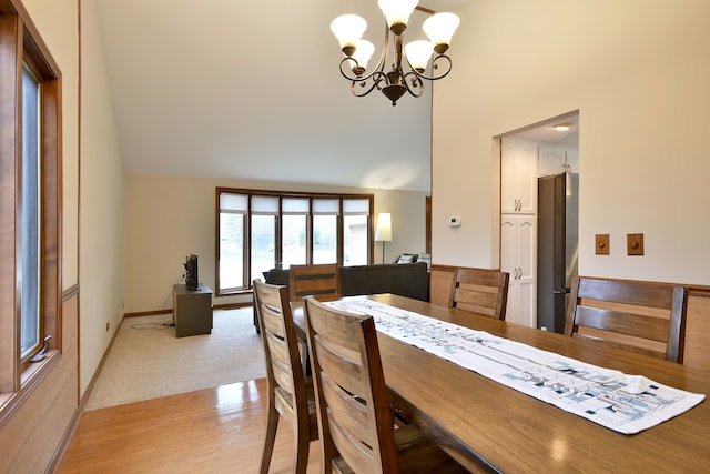 1167 Timberlane Ct, Naperville, IL 60540 - dining space featuring light wood-type flooring, a chandelier, and high vaulted ceiling
