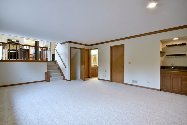 1167 Timberlane Ct, Naperville, IL 60540 - unfurnished living room featuring visible vents, crown molding, light carpet, baseboards, and stairway