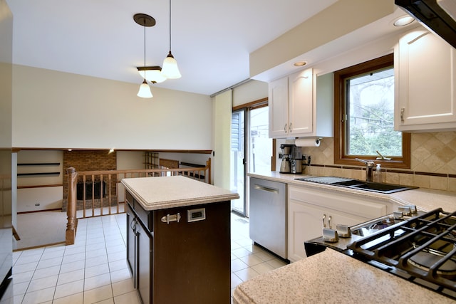 1167 Timberlane Ct, Naperville, IL 60540 - kitchen with hanging light fixtures, plenty of natural light, stainless steel dishwasher, and white cabinets