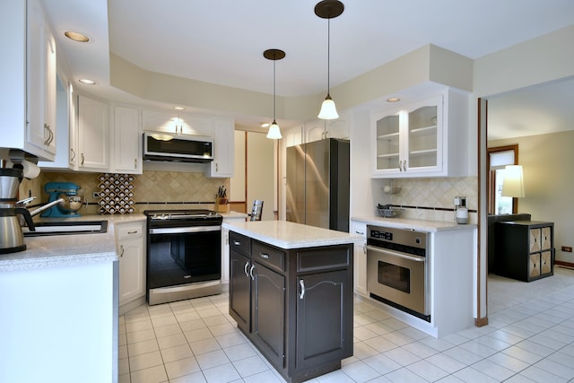 1167 Timberlane Ct, Naperville, IL 60540 - kitchen with white cabinetry, appliances with stainless steel finishes, light tile patterned flooring, and tasteful backsplash