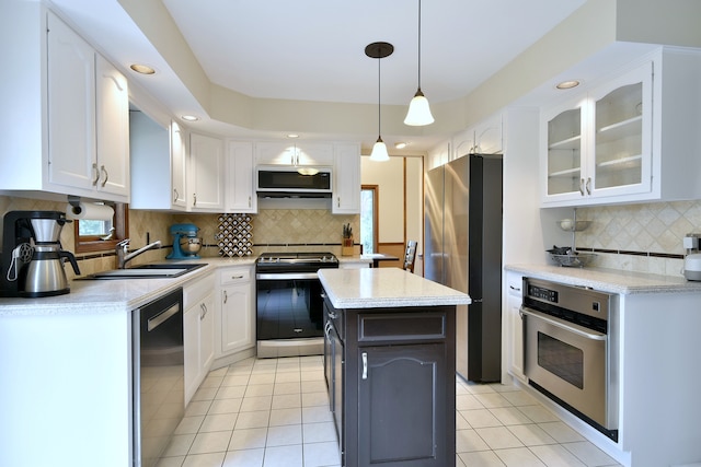 1167 Timberlane Ct, Naperville, IL 60540 - kitchen featuring white cabinets, appliances with stainless steel finishes, a sink, decorative backsplash, and light tile patterned floors