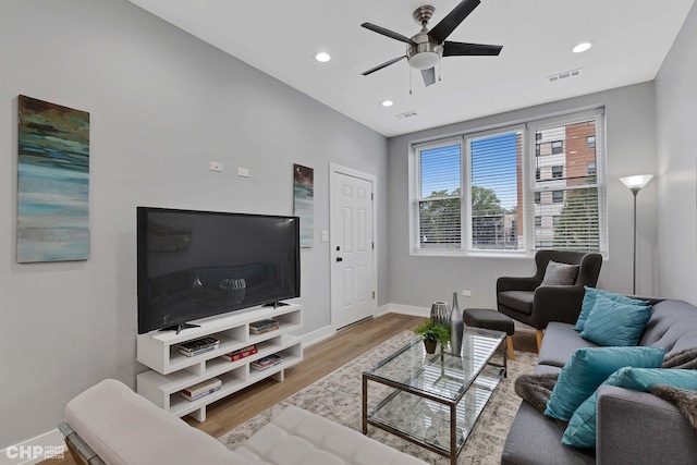 living area with ceiling fan, visible vents, recessed lighting, wood finished floors, and baseboards
