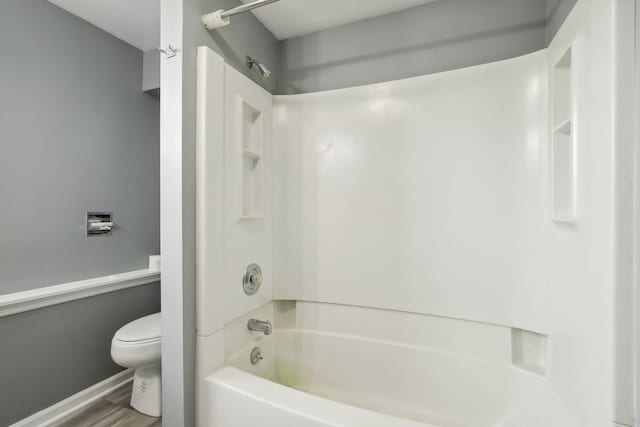 135 Cora Ave, Fox Lake, IL 60020 - full bathroom with toilet, shower / bathtub combination, wood finished floors, and baseboards