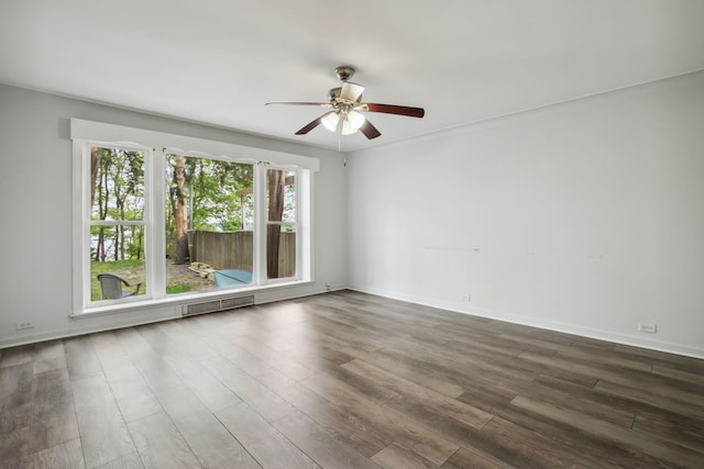 135 Cora Ave, Fox Lake, IL 60020 - empty room with a ceiling fan, dark wood-style floors, and baseboards
