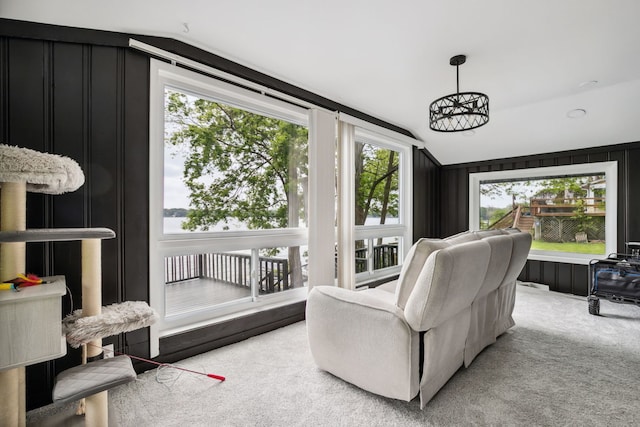 135 Cora Ave, Fox Lake, IL 60020 - carpeted living area featuring vaulted ceiling, a decorative wall, and a water view