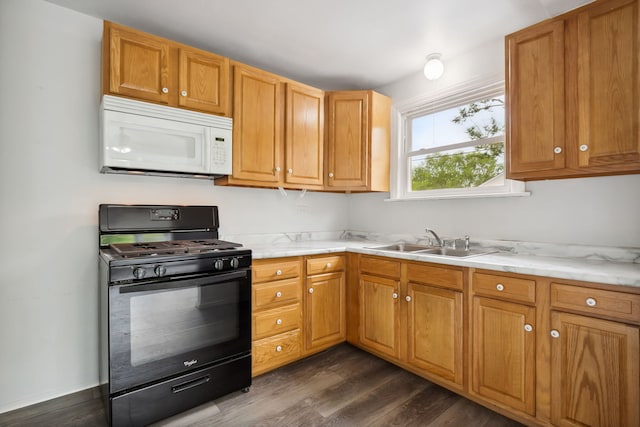 135 Cora Ave, Fox Lake, IL 60020 - kitchen featuring black range with gas cooktop, white microwave, a sink, and dark wood-style floors