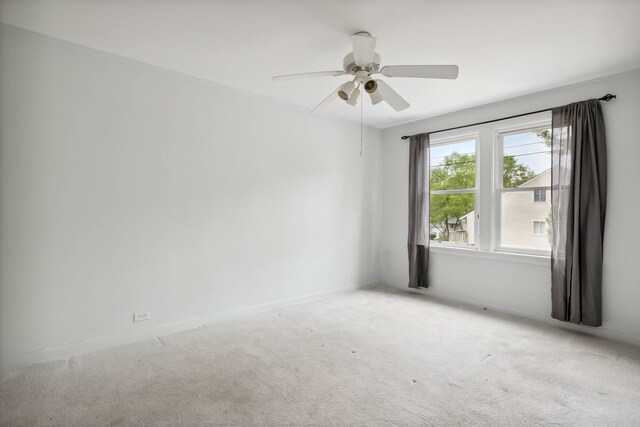 135 Cora Ave, Fox Lake, IL 60020 - unfurnished room with carpet flooring, a ceiling fan, and baseboards