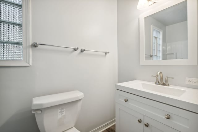 135 Cora Ave, Fox Lake, IL 60020 - bathroom with healthy amount of natural light, toilet, and vanity