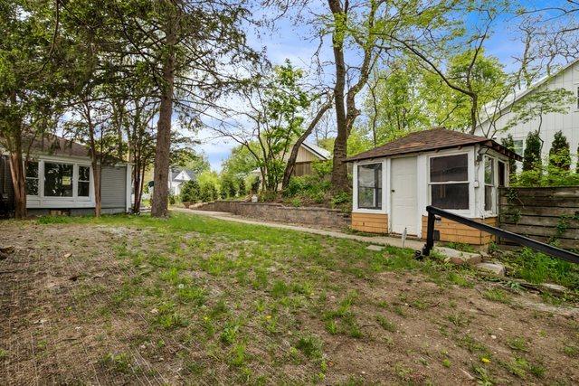 135 Cora Ave, Fox Lake, IL 60020 - view of yard featuring fence and an outdoor structure