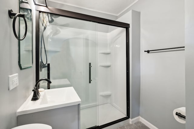 135 Cora Ave, Fox Lake, IL 60020 - bathroom with a shower stall, baseboards, toilet, crown molding, and vanity