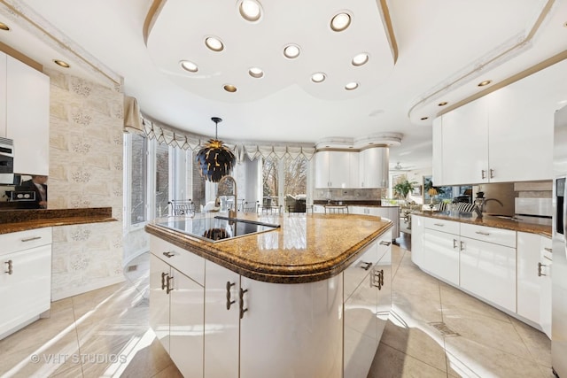 1525 Woodcrest Ct, Aurora, IL 60502 - kitchen featuring a warming drawer, appliances with stainless steel finishes, white cabinetry, and a sink