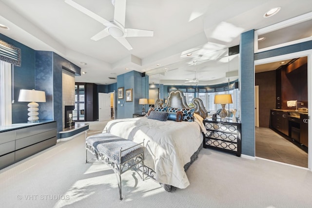 1525 Woodcrest Ct, Aurora, IL 60502 - carpeted bedroom featuring a ceiling fan, access to outside, and a fireplace