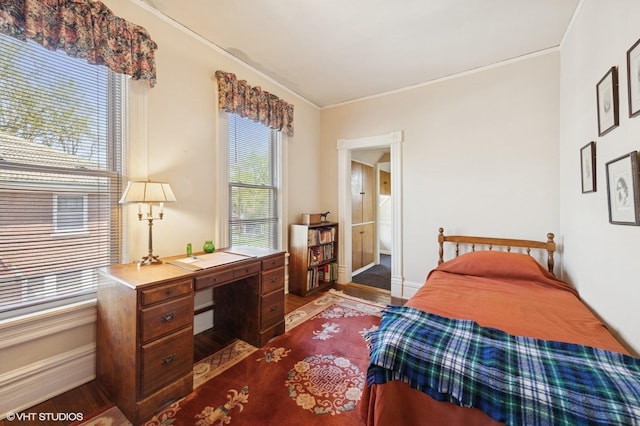 607 Thatcher Ave, River Forest, IL 60305 - bedroom with crown molding, baseboards, ensuite bath, and wood finished floors