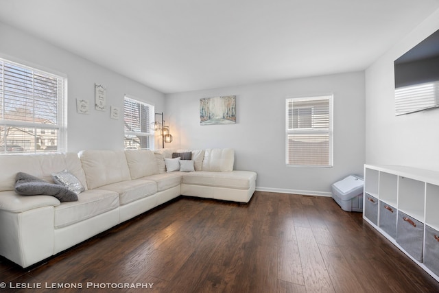 living area featuring dark wood finished floors and baseboards