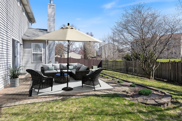 view of yard with an outdoor living space, a fenced backyard, and a patio