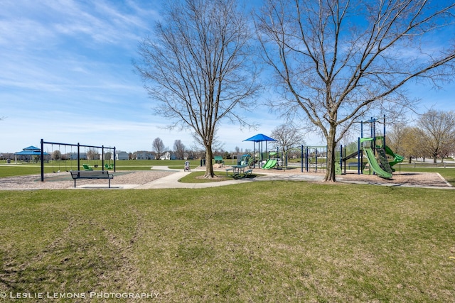 community jungle gym with a lawn