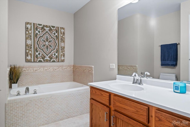 full bathroom with a bath, toilet, vanity, and tile patterned flooring