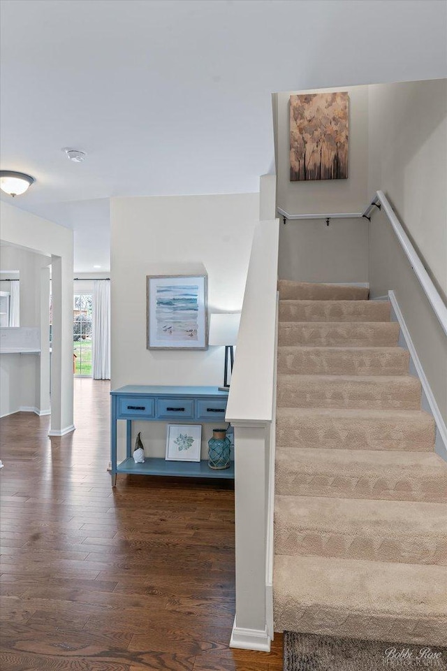 stairs with wood finished floors