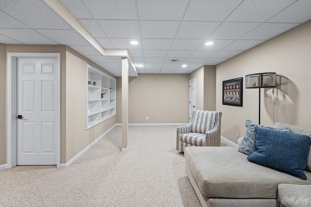 sitting room featuring recessed lighting, carpet, a drop ceiling, and baseboards