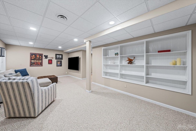 carpeted living room with baseboards, recessed lighting, and built in shelves