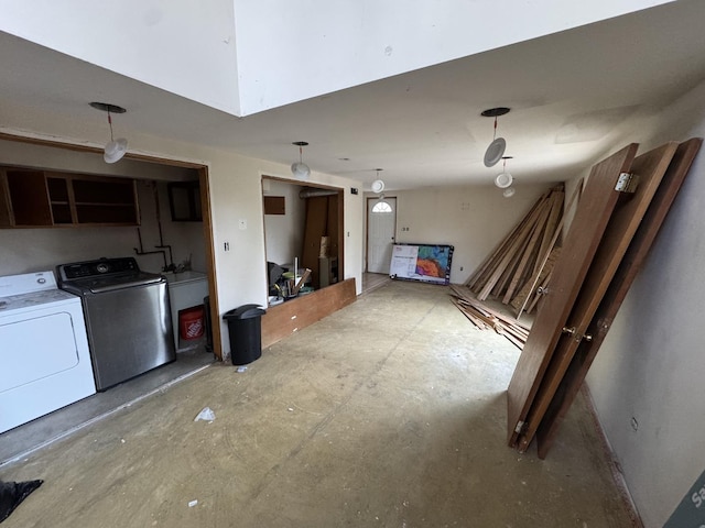 interior space with washing machine and clothes dryer and concrete flooring
