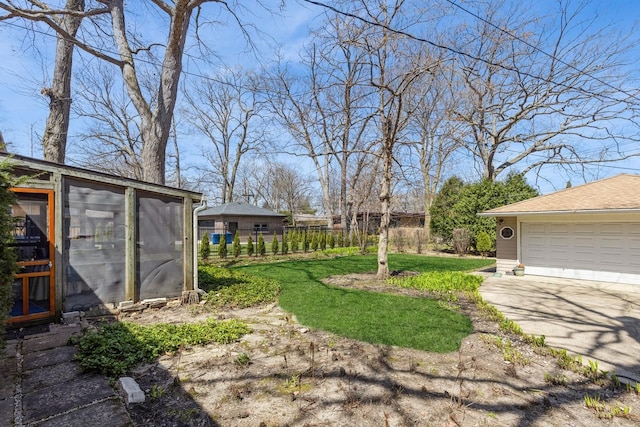 3528 Forest Ave, Wilmette, IL 60091 - view of yard featuring fence, an outbuilding, and a garage