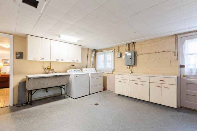 3528 Forest Ave, Wilmette, IL 60091 - laundry room featuring washing machine and dryer, electric panel, a wealth of natural light, and cabinet space