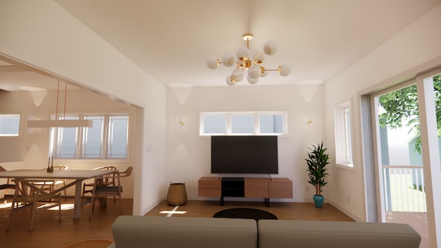 living room featuring an inviting chandelier, baseboards, and wood finished floors