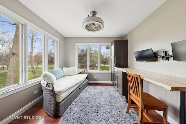 home office with baseboards, wood finished floors, and a wealth of natural light