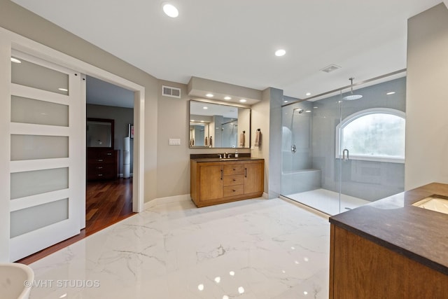 bathroom featuring visible vents, recessed lighting, vanity, and a shower stall