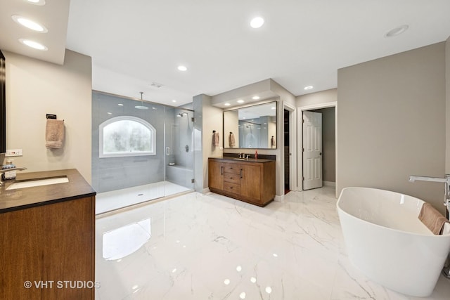 full bath featuring a sink, a walk in shower, marble finish floor, and two vanities
