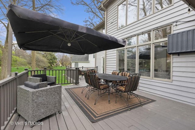 wooden deck with outdoor dining area