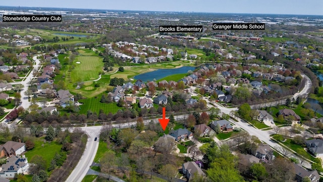 birds eye view of property featuring a residential view, a water view, and golf course view