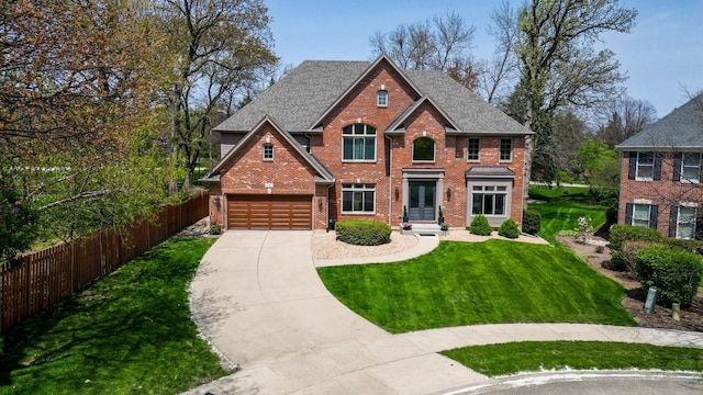 view of front facade with a garage, a front lawn, fence, brick siding, and driveway