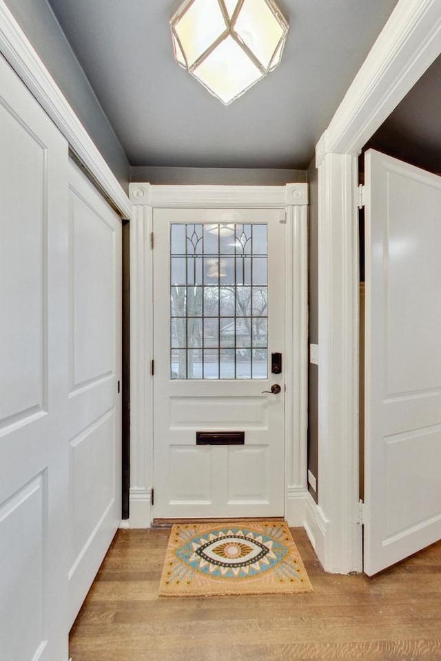 doorway with wood finished floors