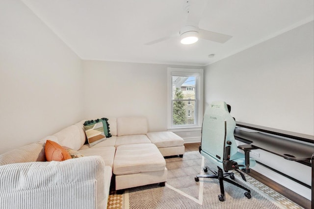 office with wood finished floors, baseboards, and a ceiling fan