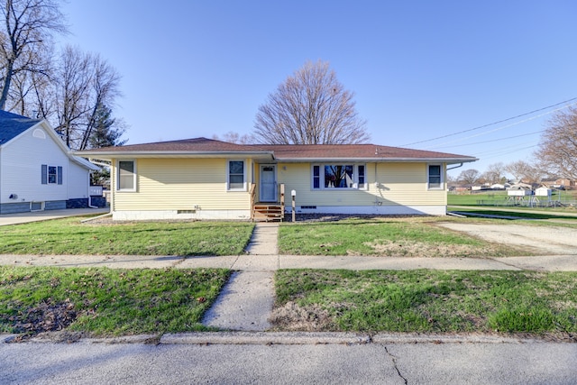 view of front of property with crawl space and a front lawn