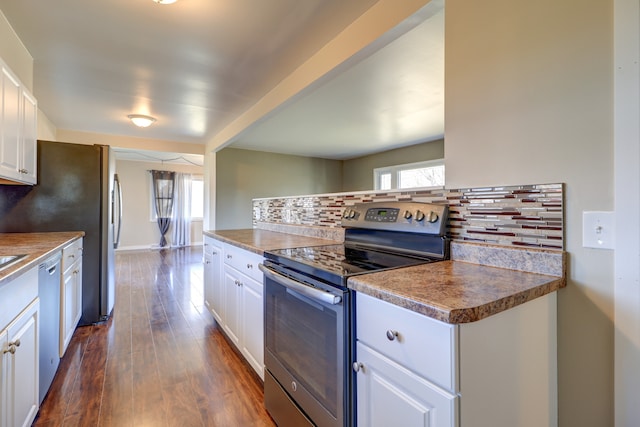 kitchen featuring white cabinets, dark wood finished floors, tasteful backsplash, and stainless steel range with electric stovetop
