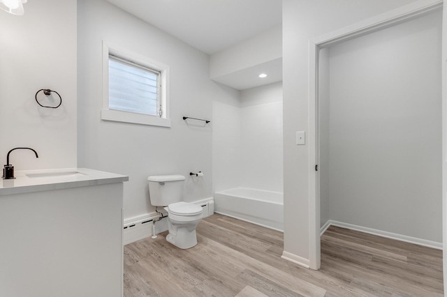 280 Westerfield Pl, Grayslake, IL 60030 - full bathroom featuring baseboard heating, wood finished floors, a sink, toilet, and bathing tub / shower combination