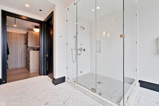 full bathroom with a stall shower and recessed lighting