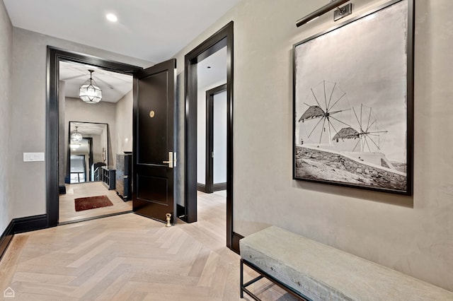 corridor featuring baseboards and recessed lighting