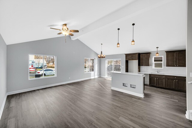 1409 172nd St, Hazel Crest, IL 60429 - interior space with ceiling fan with notable chandelier, dark brown cabinetry, a sink, open floor plan, and dark wood-style floors