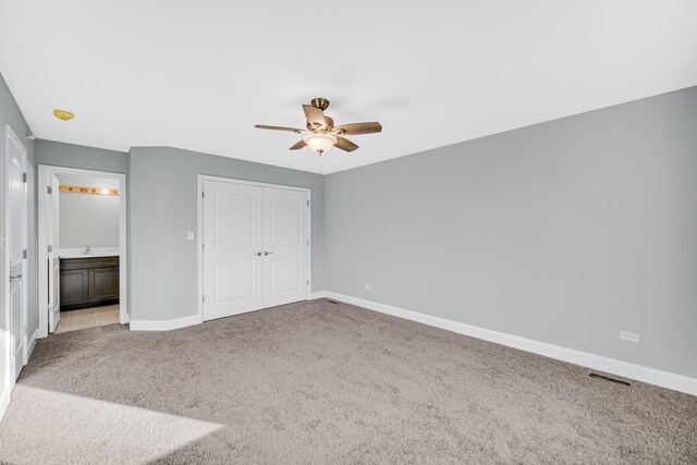 1409 172nd St, Hazel Crest, IL 60429 - unfurnished bedroom featuring a closet, light colored carpet, and baseboards