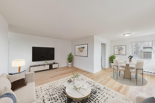 700 W Bittersweet Pl Unit 807, Chicago, IL 60613 - living area with light wood-style floors, baseboards, and a baseboard heating unit